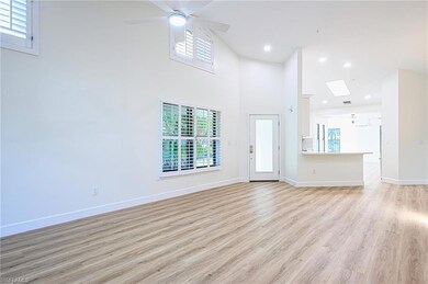 Unfurnished living room featuring light hardwood /