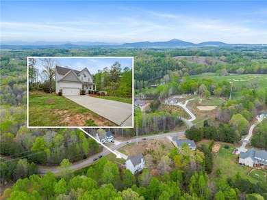 Bird's eye view featuring a view of trees and a mo