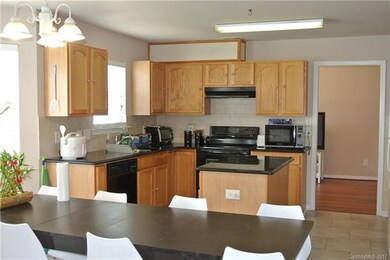 Kitchen with granite countertops, island and recen
