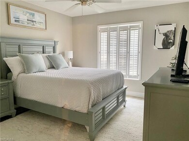 Guest bedroom featuring ceiling fan and queen size
