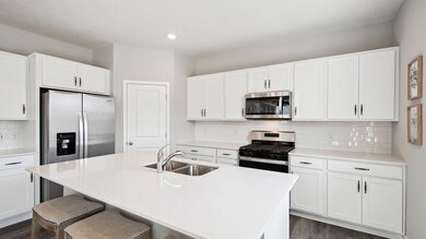 Ample storage in this kitchen between the cabinet space and the walk-in pantry offer an ideal space for any cook or baker. *Photos are of model home, finishes in actual home may vary.