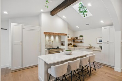 Kitchen with high end stainless steel range, a si