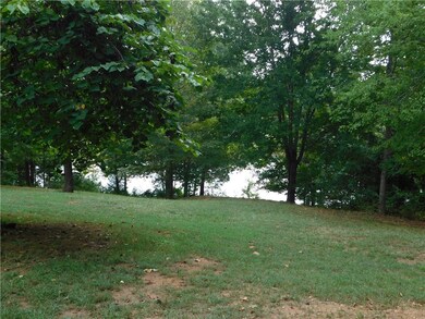 Large back yard leading down to the private pond.