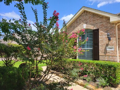 The beautiful landscaping in the front and side yards is maintained by the homeowners association!
