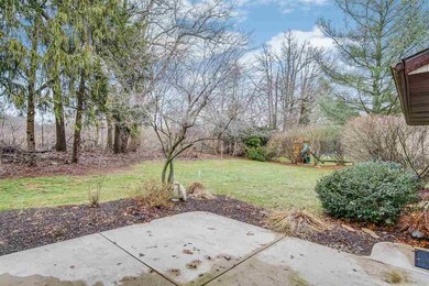 Private patio is landscaped with a perennial plant