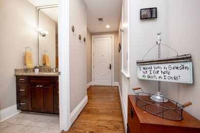 View towards the front entry way, alcove, and acce