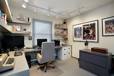 Office or 5th bedroom. Photo shows built-in desk a