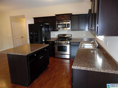 Island & breakfast bar, pantry, lots of cabinets a