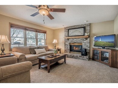 Family room features floor-to-ceiling brick gas fi