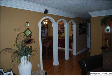 Archways to the formal dining room, featuring hard