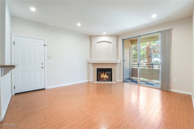Unfurnished living room with light wood-style floo