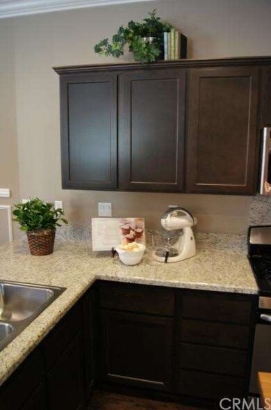 Standard granite countertops and kitchen cabinetry