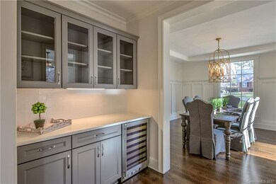 Buffet/Bar area with wine fridge and custom cabine