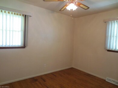 Second bedroom with ceiling fan, hardwood floor