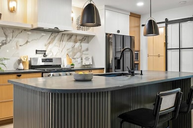 Kitchen featuring appliances with stainless steel
