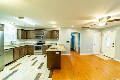 Living room and kitchen from master bedroom door