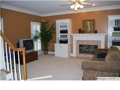 Spacious Den with built-in bookcases, fireplace wi
