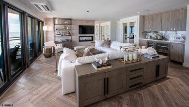 Open layout with fireplace and full wet bar.