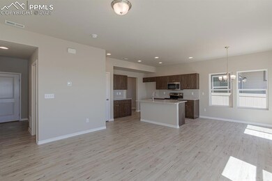 Kitchen with appliances with stainless steel finis