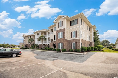 View of property featuring uncovered parking and a residential view