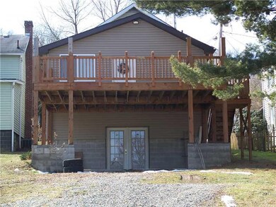 Exterior Back. Large wooden  Deck with what  could