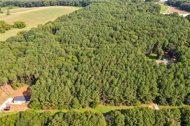 Birds eye view of property with a rural view