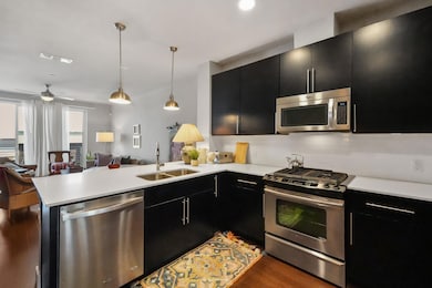 Kitchen featuring appliances with stainless steel