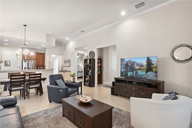 Living room with light tile patterned flooring, or
