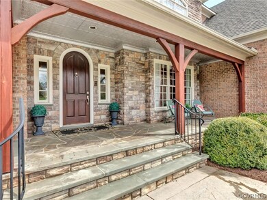Stone & Brick home ~ take note of the arched front