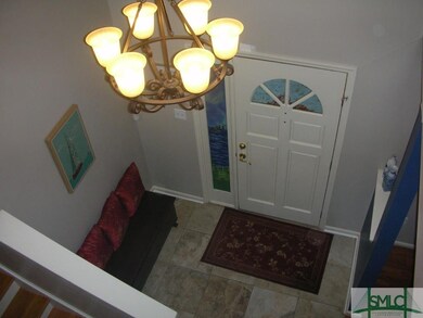 Two story foyer welcomes your guests.