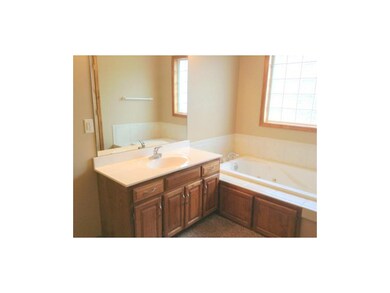 Master bathroom with double vanities, jetted tub, 