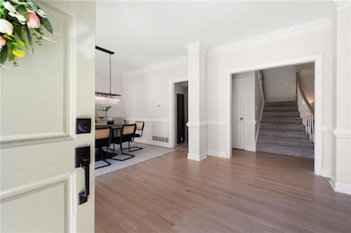 Office with ornamental molding, baseboards, visibl