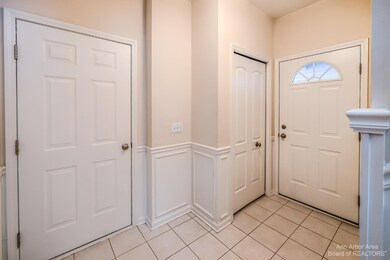 Foyer, closet and garage door