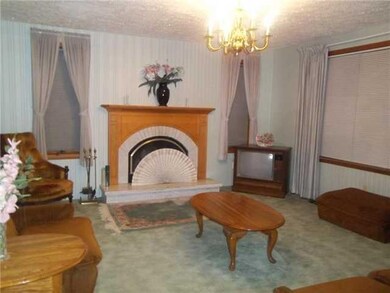 Family Room Den with marble & oak fireplace and fr