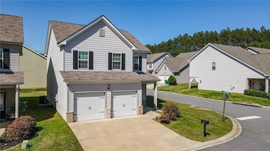 Traditional-style house with concrete driveway, a 
