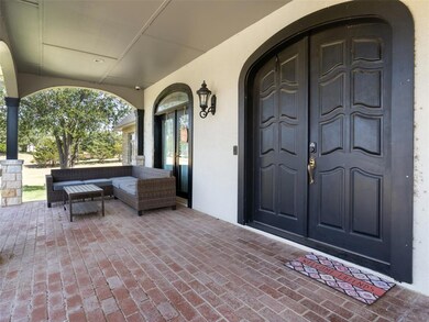 Doorway to property with covered porch