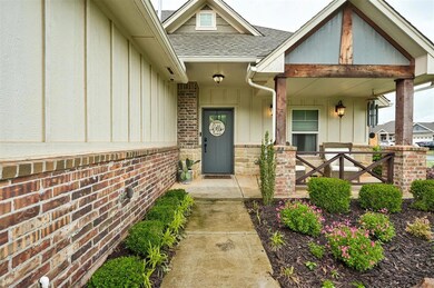 Property entrance with a shingled roof, board and batten siding, and covered porch