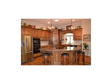 Custom cabinets and granite top island.
