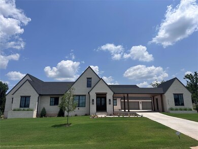 View of front of house with a garage and a front l