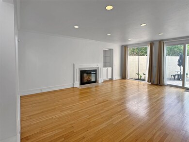 Living Room with fireplace and access to the back
