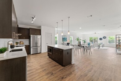 Kitchen with stainless steel appliances, dark bro