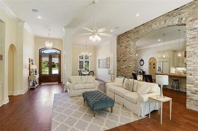 Living room with old Chicago brick archway leading