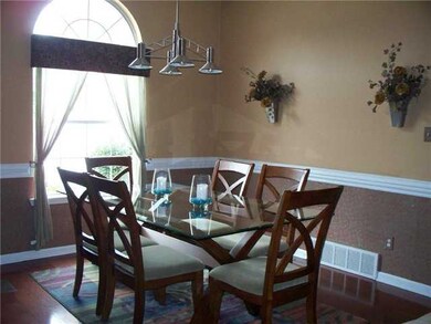 Formal Dining Room with hardwood flooring