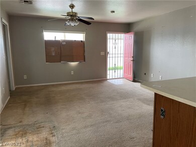 Living room to front entrance. Den located top rig