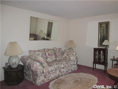 Living Room There are hardwood floors under carpet
