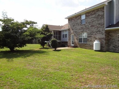 Back of home w/screened patio