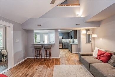 Living room featuring light hardwood floors and va