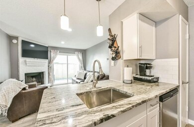 Kitchen opens up to living area; perfect for enter
