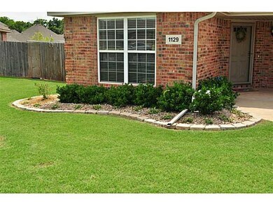 Exterior Front. Lush landscaped flowerbeds line th