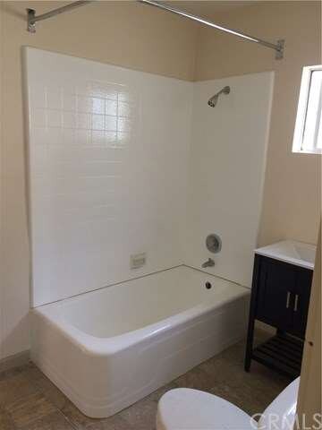 Re-glazed tub/tile, new vanity, new sink, new floo